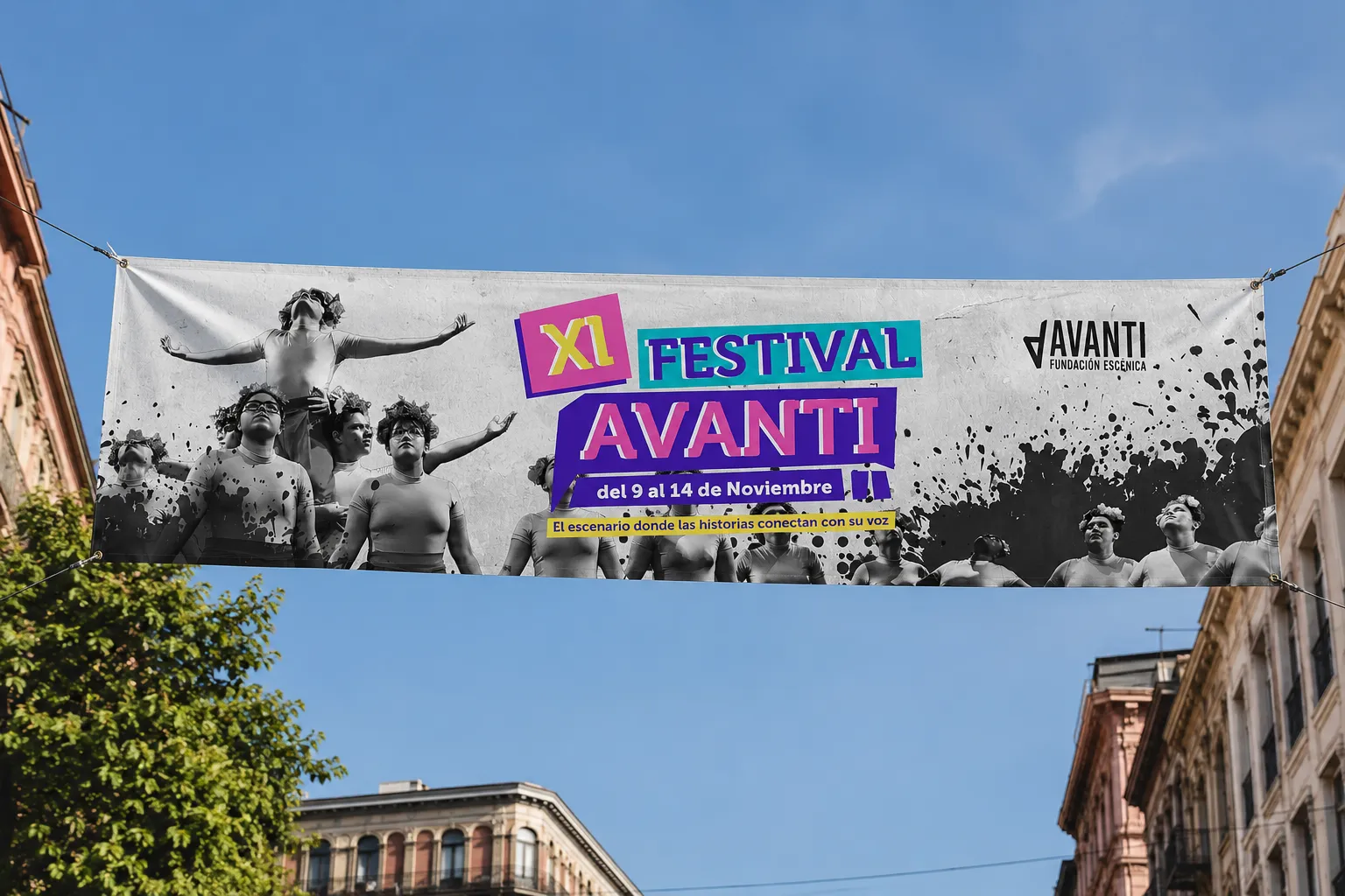Pendón del XI Festival Avanti colgado entre edificios, con la gráfica del festival y fotografía de danza